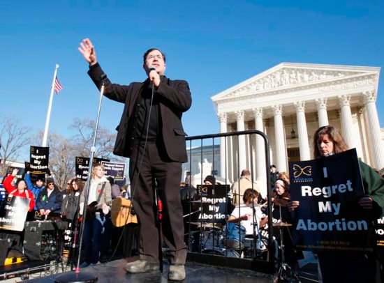 Father Frank Pavone, national director of Priests for Life, speaks in front of the U.S. Supreme Court at the 2009 March For Life in Washington. Pro-life supporters have denounced Father Pavone over a controversial election Facebook Live video he posted. CNS photo/Bob Roller