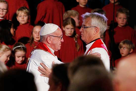 Pope Francis embraces the Rev. Martin Junge, general secretary of the Lutheran World Federation, during an ecumenical prayer service at the Lutheran cathedral in Lund, Sweden, Oct. 31. CNS/Paul Haring