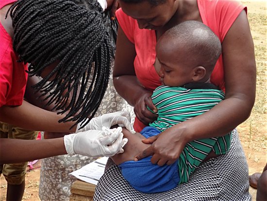 A young patient receives an inoculation.
