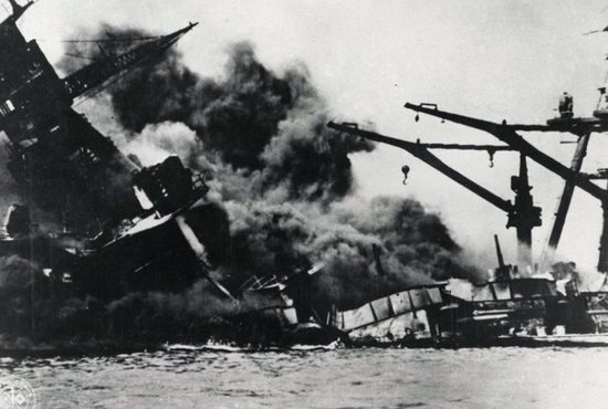 A ship is seen sinking during the Japanese attack on Pearl Harbor Dec. 7, 1941. A Catholic military chaplain and historian says the attack on Pearl Harbor, even 75 years later, continues to rivet the attention of Americans because it was "such a powerful event." CNS photo/Pearl Harbor Museum