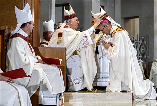 Hartford Archbishop Leonard Blair places a miter on the head of Bishop Juan Miguel Betancourt Torres during his ordination Mass Oct. 18 at the Cathedral of St. Joseph in Hartford, Connecticut