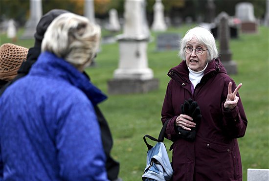 Mary-Benton Hummel, a St. Paul Community Education instructor, gives a tour of Calvary Cemetery in St. Paul 