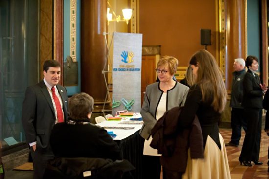 Trish Wilger, second from right, executive director of Iowa Alliance for Choice in Education, talks with other school choice advocates in early April at the Iowa Capitol in Des Moines. The Internal Revenue Service is proposing a rule change that would impact about 30 percent of the student population in Catholic schools in the Archdiocese of Dubuque and thousands of others in nonpublic schools in Iowa and other states.