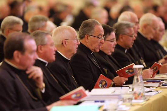Prelates pray during the 2017 fall general assembly of the U.S. Conference of Catholic Bishops in Baltimore. Discussion and voting on concrete measures to address the abuse crisis and a day of spiritual discernment and prayer will top the agenda for the U.S. bishops when they meet Nov. 12-14 in Baltimore.