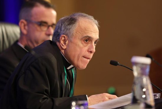 Cardinal Daniel N. DiNardo of Galveston-Houston, president of the U.S. Conference of Catholic Bishops, listens to a question Nov. 12 during the fall general assembly of the USCCB in Baltimore. Also pictured is Msgr. J. Brian Bransfield, general secretary.