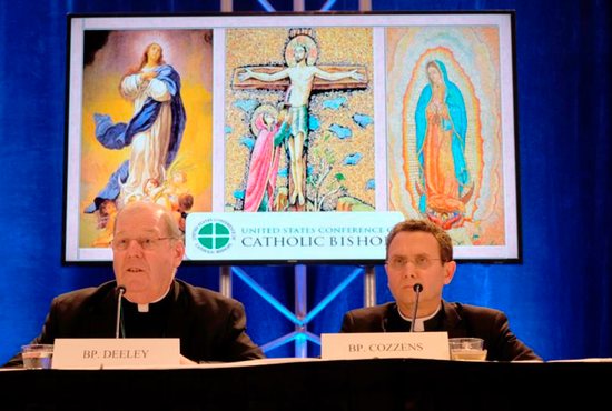 Bishop Robert P. Deeley of Portland, Maine, and Auxiliary Bishop Andrew H. Cozzens of St. Paul and Minneapolis attend a news conference Nov. 13 at the fall general assembly of the U.S. Conference of Catholic Bishops in Baltimore. 