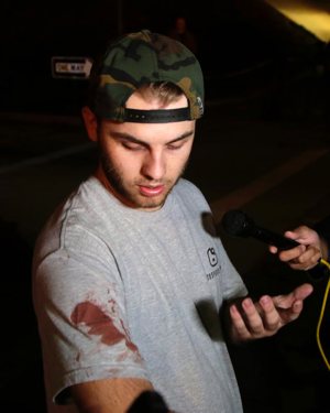 Matt Wennerstorm, seen with blood on his shirt, talks to the media Nov. 8 outside the Borderline Bar and Grill in Thousand Oaks, Calif. The gunman, who opened fire without warning late Nov. 7, was found dead inside the establishment, authorities said.