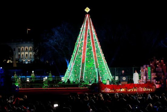 U.S. President Donald Trump and first lady Melania Trump participate in the 96th annual National Christmas Tree Lighting ceremony near the White House in Washington. 