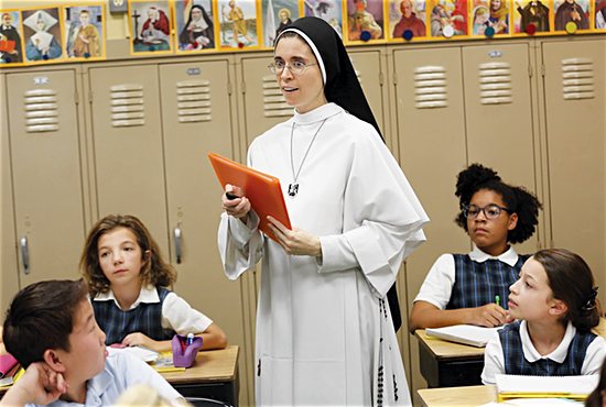 Sister Mary Margaret O’Brien of the Dominican Sisters of Mary, Mother of the Eucharist talks about her patron saint to fifth-graders in her religion class at St. Agnes School in St. Paul Oct. 29.
