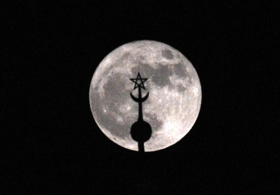 In this 2016 file photo, a super moon rises above the roof of the Mohammed V mausoleum in Rabat, Morocco. Pope Francis is scheduled to visit the North African nation in March 2019.