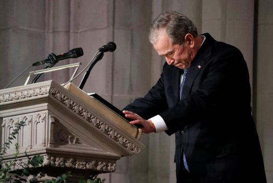 Former U.S. President George W. Bush pauses as he speaks at the state funeral for his father, former President George H.W. Bush, Dec. 5 at the Episcopal Church's Washington National Cathedral.