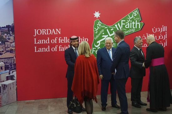 Jordan's King Abdullah II, second from right, Palestinian President Mahmoud Abbas, center, and Jordan's Crown Prince Hussein bin Abdullah II greet Christians during Christmas celebrations hosted by the Jordanian monarch at the King Hussein Cultural Center in Amman Dec. 18. 