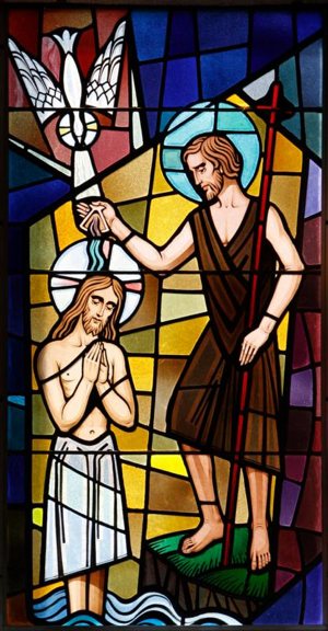 Christ's baptism by John the Baptist at the Jordan River is depicted in a stained-glass window at St. Francis of Assisi Church in Greenlawn, N.Y.