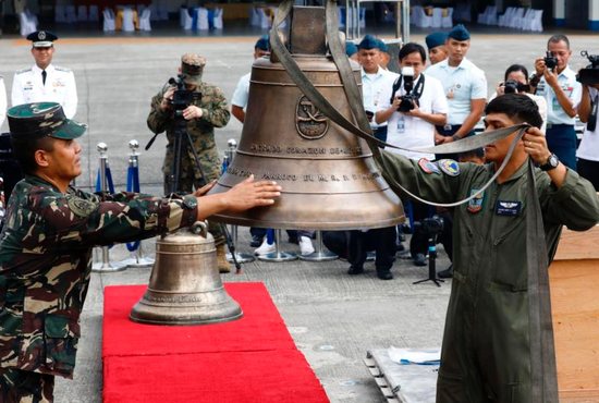 Philippine soldiers use a crane to lift three Balangiga Bells off crates during a turnover ceremony Dec. 11 at Villamor Air Base near Manila. After more than a century, the United States government has returned the three church bells swiped by American forces as war booty from the central Philippine town of Balangiga in 1901. 