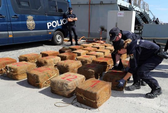 Spanish national police officers unload bales of seized drugs in Las Palmas, on the Canary island of Gran Canaria, Spain, Oct. 23. Pope Francis said illegal drug makers and dealers are traffickers of death and must be stopped.