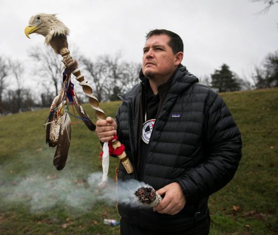 Ray St Clair of the Saginaw Chippewa Indian Tribe of Michigan prays outside Covington Catholic High School Jan. 23 in Park Hills, Ky. Days after an encounter between Covington Catholic High School students and a Native American tribal leader in Washington, the Diocese of Covington announced it would begin a third-party investigation into what happened at the foot of the Lincoln Memorial following the annual March for Life Jan. 18.