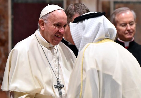 Pope Francis greets an ambassador during an annual meeting to exchange greetings for the new year with diplomats accredited to the Holy See, at the Vatican Jan. 7.