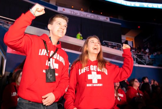 At the Archdiocese of Washington's Jan. 18 Youth Rally for Life at the Capital One Arena, Matteo Caulfield and Caroline Rotkis, seniors from Benet Academy, a Benedictine school in Lisle, Ill., join fellow students from their school in wearing matching red hooded sweat jackets with the words "LIFE GUARD" emblazoned on the front. They had made a 15-hour bus ride to attend the rally, Mass and March for Life.
