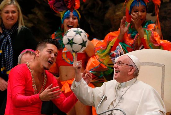 Pope Francis twirls a soccer ball presented by a member of CirCuba, the Cuban national circus, during his general audience in Paul VI hall at the Vatican