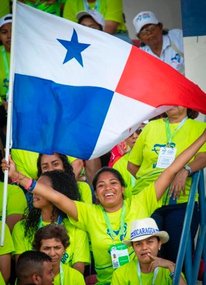A World Youth Day volunteer waves her Panamanian flag as she cheers for Pope Francis at Panama City's Rommel Fernandez Stadium Jan. 27, 2019. Pope Francis thanked volunteers for making World Youth Day a reality. 