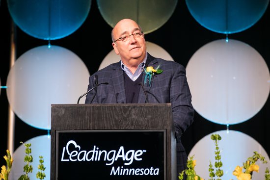 Bill Foussard, a member of the board of Cerenity Senior Care in St. Paul, accepts the Board Trustee of the Year award Feb. 6 from LeadingAge Minnesota at a ceremony at the  St. Paul RiverCenter in St. Paul. 