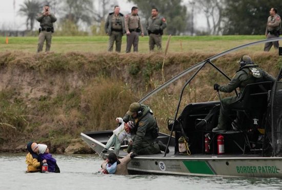 A U.S. Border Patrol boat rescues migrants crossing the Rio Grande toward the United States, seen from Piedras Negras, Mexico, Feb. 10, 2019. Hard-fought legislation that gives President Donald Trump 55 additional miles of barrier along the U.S.-Mexico border, well short of what he requested, was on its way to his desk Feb. 15, 2019, after the House and Senate both passed the measure late Feb. 14.