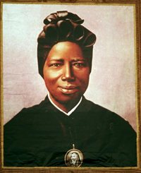 A tapestry portrait of St. Josephine Bakhita, an African slave who died in 1947, hangs from the facade of St. PeterÕs Basilica during her canonization in 2000 at the Vatican. St. Bakhita was born in the Darfur region of what is now Sudan. Her feast day is Feb. 8, the International Day of Prayer and Awareness against Human Trafficking.