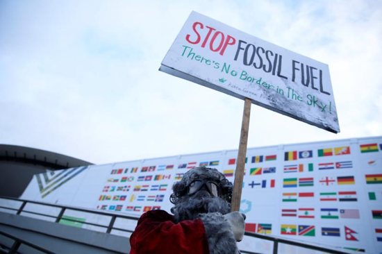 Environmental activist protests against fossil fuel outside the COP24 U.N. Climate Change Conference in Katowice, Poland, Dec. 10, 2018. The Austrian bishops' conference said March 22 it would divest from fossil fuels within five years.