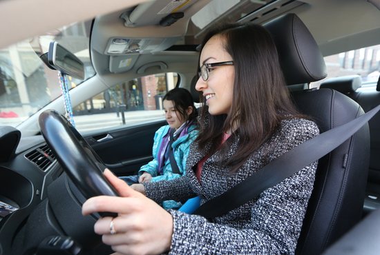 Alejandra Chavez Rivas gets ready to drive her daughter, Daniela, home to Monticello March 26 after picking her up at St. Agnes School in St. Paul.