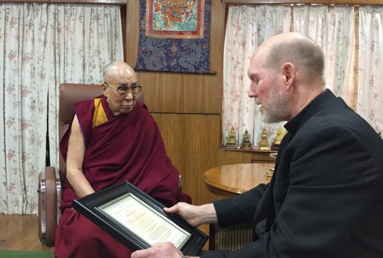 Bishop Thomas R. Zinkula of Davenport, Iowa, presents the Dalai Lama, the exiled spiritual leader of Tibet, with the Pacem in Terris Peace and Freedom Award at the Dalai Lama's residence in India March 4, 2019. The Dalai Lama is a renowned peacemaker and Nobel Peace Prize recipient.