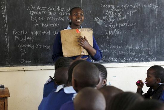 A young woman leads her classmates at a primary school in Nairobi, Kenya, Sept. 9, 2015. The empowerment of women was the focus of a March 19 panel discussion at the United Nations, with the speakers saying that women should not be required to divest themselves of femininity to achieve empowerment and gender equality.
