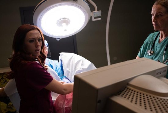 Abby Johnson, portrayed by Ashley Bratcher, reacts to what she is seeing on the ultrasound screen while assisting with an abortion in this clip from the movie "Unplanned." The movie will officially be released March 29, 2019, although in some locations it could be seen as early as March 25. CNS photo/courtesy
