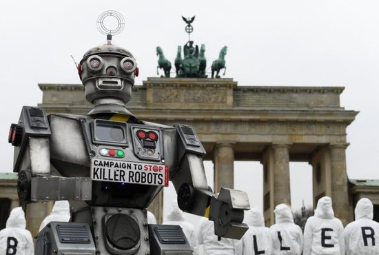 Activists from the Campaign to Stop Killer Robots, a coalition of nongovernmental organizations opposing lethal autonomous weapons, protest at the Brandenburg Gate in Berlin March, 21, 2019