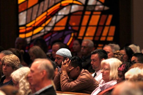 A man reacts during a candlelight vigil April 27, 2019, at Rancho Bernardo Community Presbyterian Church for victims of a shooting incident at the Congregation Chabad synagogue in Poway, Calif., near San Diego. In response to the shooting, Cardinal Daniel N. DiNardo of Galveston-Houston and president of the U.S. Conference of Catholic Bishops, said in an April 28 statement: "Our country should be better than this; our world should be beyond such acts of hatred and anti-Semitism."