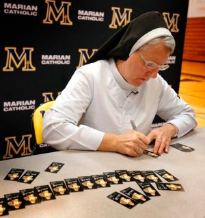 Dominican Sister Mary Jo Sobieck, a theology teacher at Marian Catholic High School in Chicago, kicked off baseball season by debuting her very own 2019 Topps Allen and Ginter Baseball Trading Card April 8, 2019. Known as the "Curveball Queen," Sister Mary Jo signed 260 baseball cards that will be inserted into random Topps trading card packs.