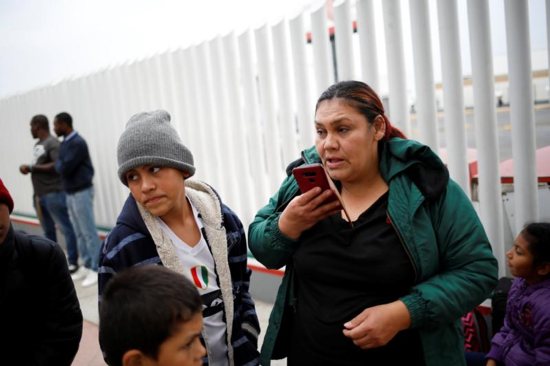 Asylum seeker Antonia Portillo Cruz speaks on the phone in Tijuana, Mexico, April 25, 2019, before crossing to the U.S. to appear in front of an immigration judge. During an April 30 hearing before the House Committee on Homeland Security Subcommittee on Border Security, Bishop Mark J. Seitz of the Diocese of El Paso, Texas, spoke of his border community's response assisting asylum-seeking families who have been released by the U.S. Department of Homeland Security. 