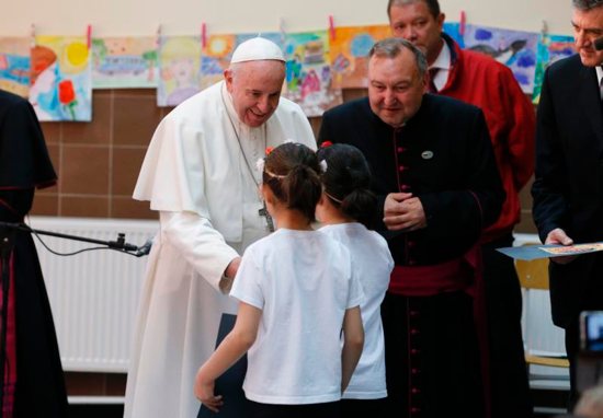 Pope Francis greets children as he visits with refugees in Sofia, Bulgaria, May 6, 2019.
