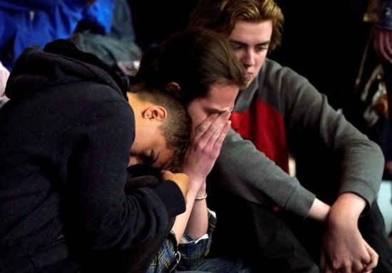 Students mourn during a vigil May 8, 2019, for victims of a shooting at the STEM School Highlands Ranch in Colorado. Catholic leaders are calling for prayer and action in response to the May 7 shooting inside the charter school near Denver that focuses on science, technology, engineering and math. Kendrick Castillo, an 18-year-old Catholic senior was killed when he "lunged" at one of the shooters to save others. Eight other students were wounded. 