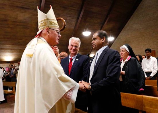 New York Cardinal Timothy M. Dolan greets Amrith Rohan Perera, Sri Lanka's permanent representative to the United Nations, at the beginning of Mass May 12, 2019, at St. Adalbert Church in the Staten Island borough of New York. Cardinal Dolan celebrated the liturgy for the repose of the souls of the more than 250 people killed in the Easter suicide bombings in Sri Lanka. The cardinal also led prayers to end the persecution of Christians throughout the world. 