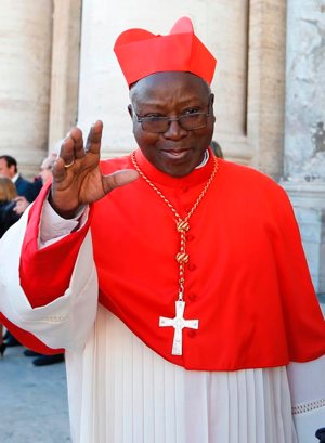 Cardinal Philippe Ouedraogo of Ouagadougou, president of the Burkina Faso bishops' conference, is pictured at the Vatican Feb. 22, 2014. Cardinal Ouedraogo and other church leaders in Burkina Faso have appealed for unity and solidarity after two attacks on Catholics within two days.