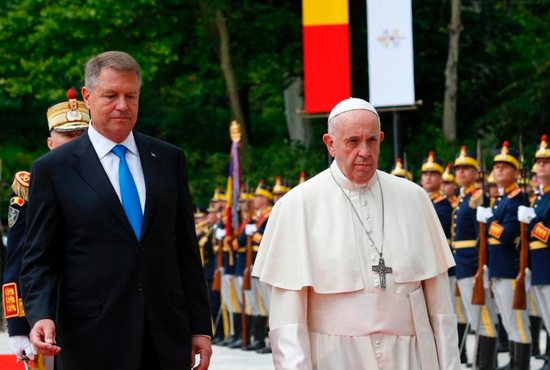 Pope Francis walks with President Klaus Iohannis of Romania during a welcoming ceremony at the entrance of the Cotroceni Palace in Bucharest, Romania, May 31, 2019. The pope is making a three-day visit to Romania.