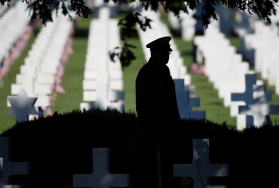 A man stands before a ceremony to mark the 75th anniversary of the D-Day at the Normandy American Cemetery and Memorial in Colleville-sur-Mer, France, June 6, 2019. 