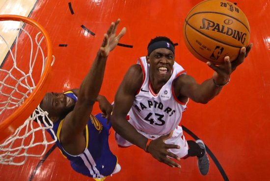 Toronto Raptors forward Pascal Siakam (43) shoots the ball against Golden State Warriors forward Draymond Green (23) in game one of the 2019 NBA Finals at Scotiabank Arena in Toronto May 30, 2019.