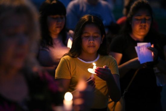 Mourners in Brownsville, Texas, honor the lives of Salvadoran migrant Oscar Alberto Martinez Ramirez and his 23 month-old daughter, Valeria during a vigil