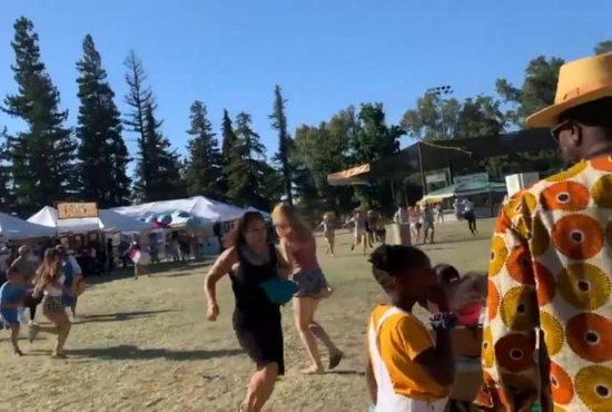 People run as an active shooter is reported at the Gilroy Garlic Festival in California