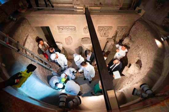 Workers inspect an ossuary at the Teutonic Cemetery at the Vatican