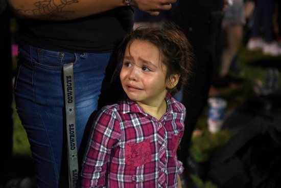 Serenity Lara cries during an Aug, 4, 2019, vigil, a day after a mass shooting at a Walmart store in El Paso