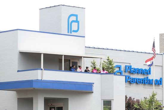 Planned Parenthood employees stand outside the facility