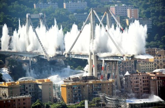 Controlled explosions demolish two of the pylons of the Morandi bridge in Genoa, Italy