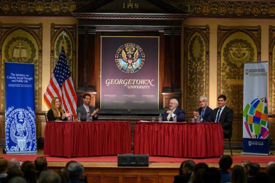 Panelists participate in a dialogue at Georgetown University